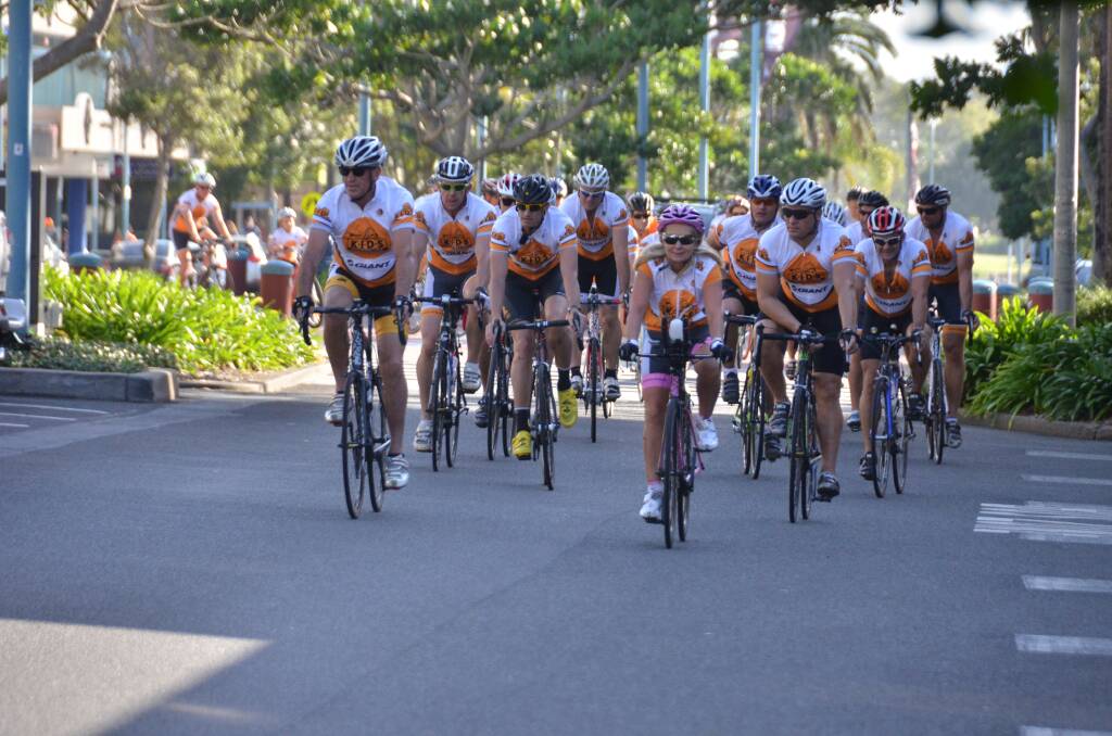 Congratulations: Founder of KIDS Foundation Susie O'Neill leads the Ride to Port cyclists to the finish of the 450km charity ride at the Glasshouse yesterday afternoon.