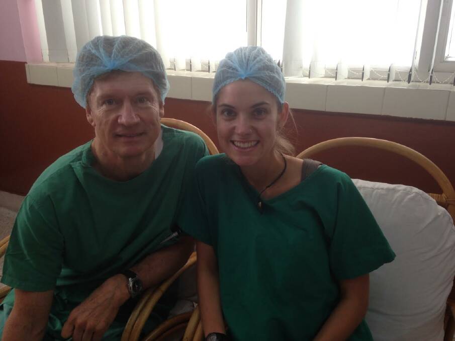 Family ties: Dr Ray Hodgson and his daughter Eloise Woods about to go into theatre at Dhulikhel in Nepal.