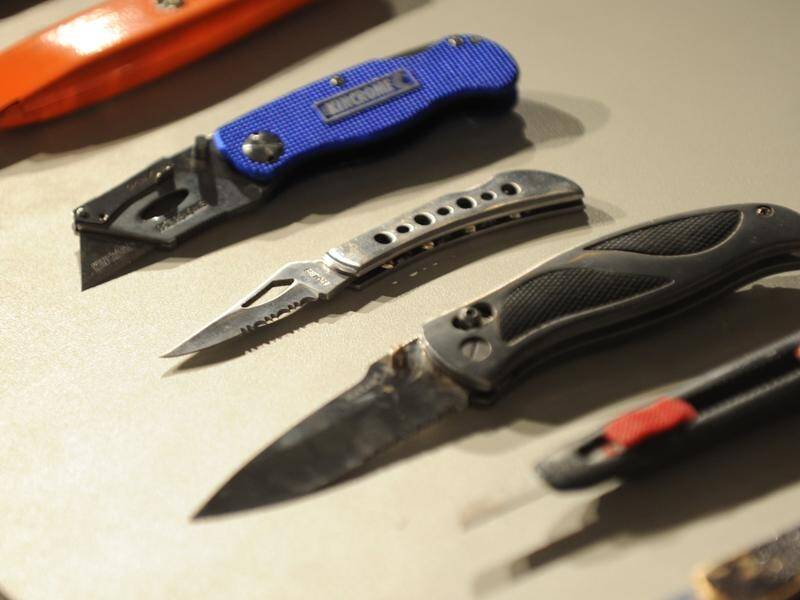 The sale of knives and replica firearms to anyone under 18 in Queensland is being banned. (Julian Smith/AAP PHOTOS)