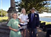 Wise words: Kaisha McGrath, Mikaela McGuire stand with Port Macquarie Returned and Services League sub-Branch's Ray Chesher at the cenotaph, where the authors will read their winning essays at Anzac Day's main service.