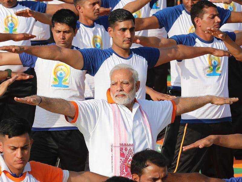 Some 50,000 people have gathered with Indian PM Narendra Modi for International Yoga Day.