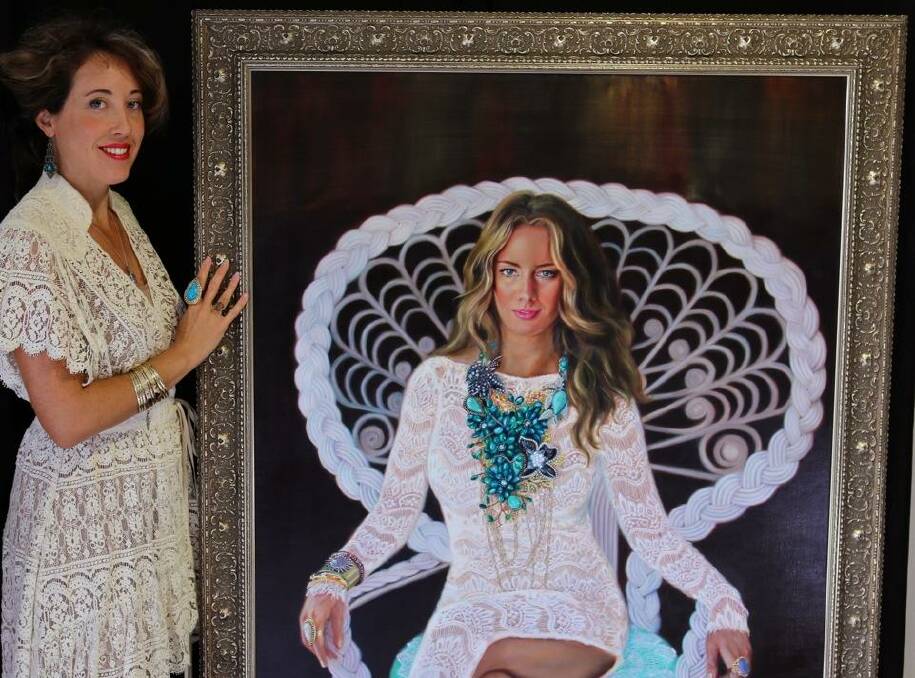Archiibald Prize entry: Artist Corinne Lewis proudly displays her portrait of Port Macquarie's internationally famous jewellery designer Samantha Wills.