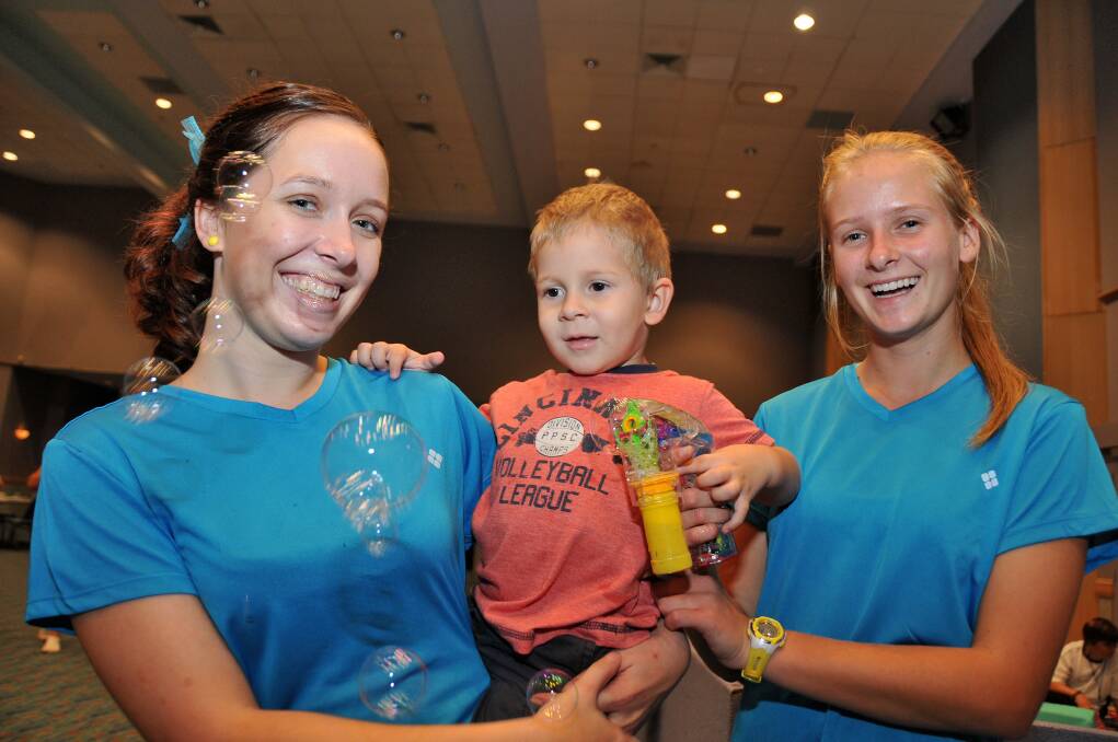 Smiling faces: Lauren Packer, Benji and Tahlia Clarke have fun at the expo.