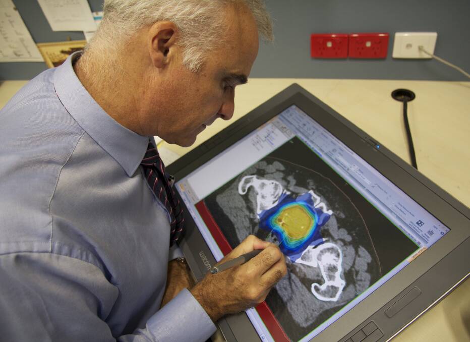 Cancer research pioneer: Associate Professor Tom Shakespeare reviews a prostate radiotherapy plan.