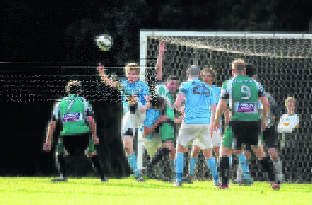 Boot to ball: Mitch Davis clears for Port FC during the derby win over Port United on Saturday. Pic: MATT McLENNAN