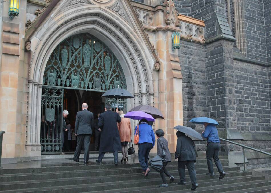 Mourners arrive to attend a a national memorial service as Australians mourn the loss of all victims of Malaysia Airlines Flight MH17 at St. Patrick's Cathedral on August 7, 2014 in Melbourne, Australia. Photo: Scott Barbour