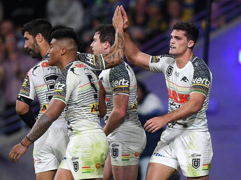Nathan Cleary (right) celebrates with teammates after a try in the Panthers' win over Parramatta.
