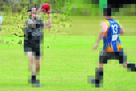 Twins against each other: Luke Long marks despite pressure from twin brother Matt Long in the Port Macquarie Magpies' big win over Macleay Valley Eagles on Saturday. Pic: MATT ATTARD