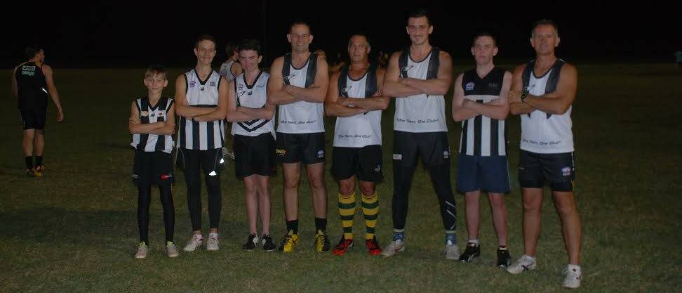 Under lights: Magpies players Alex Byrne, Dominic Byrne, Isaac King, Damon Munt (Senior Coach), Steve Long, Kyle Lynch, Josh King, Craig Carroll (U18s Coach) getting their eyes use to the light ahead of the night game.