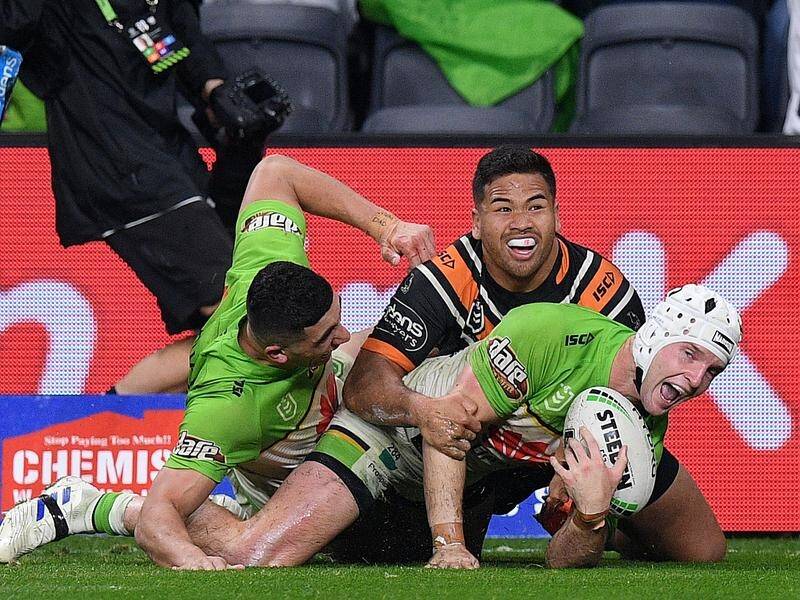 Canberra have beaten West Tigers 28-0 to consolidate their place in the NRL's top-eight