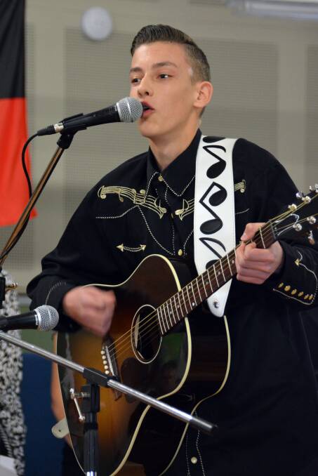 Altogether now: Songwriter Angus Gill had a ball rehearsing his song at Wauchope Public School on Wednesday.