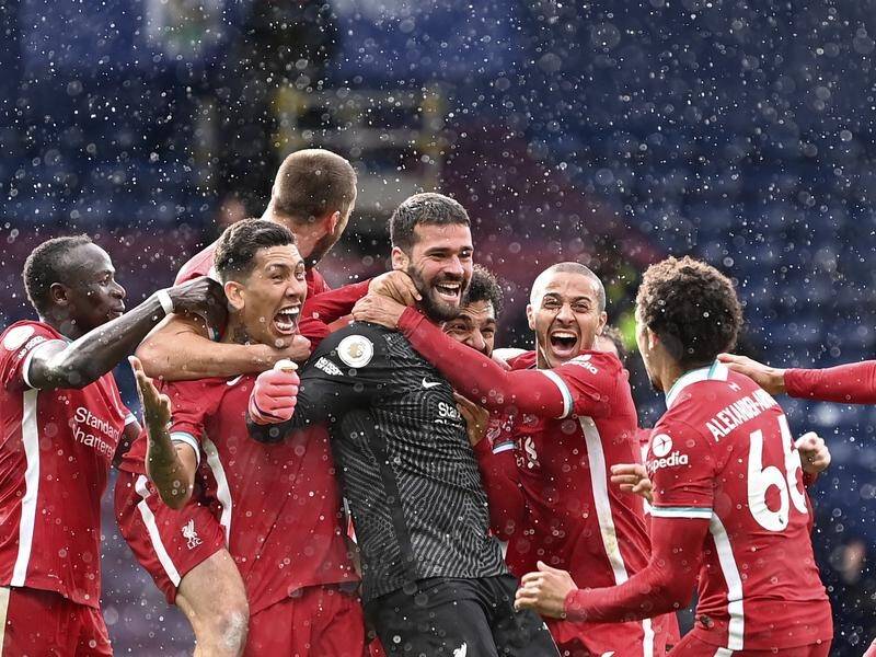 Liverpool celebrate goalkeeper Alisson's late winning goal at West Brom in the Premier League.