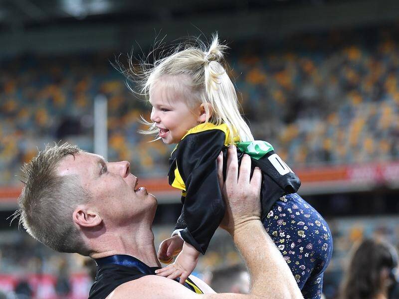 Jack Riewoldt celebrates Richmond's "special" 2020 flag with his daughter after the grand final win.