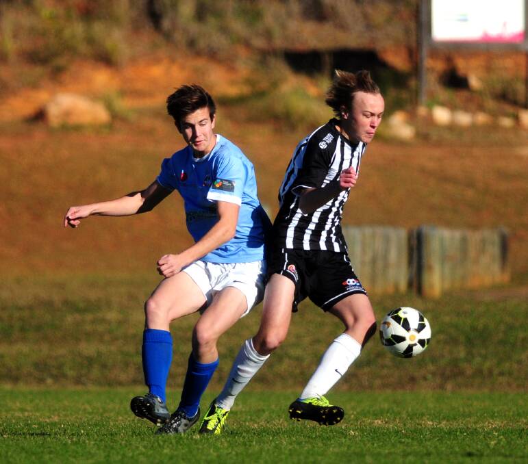 Trying to keep possession: Mid North Coast's Ryan Johnson keeps the ball at his feet in the game against Western on Sunday at Wayne Richards Park.