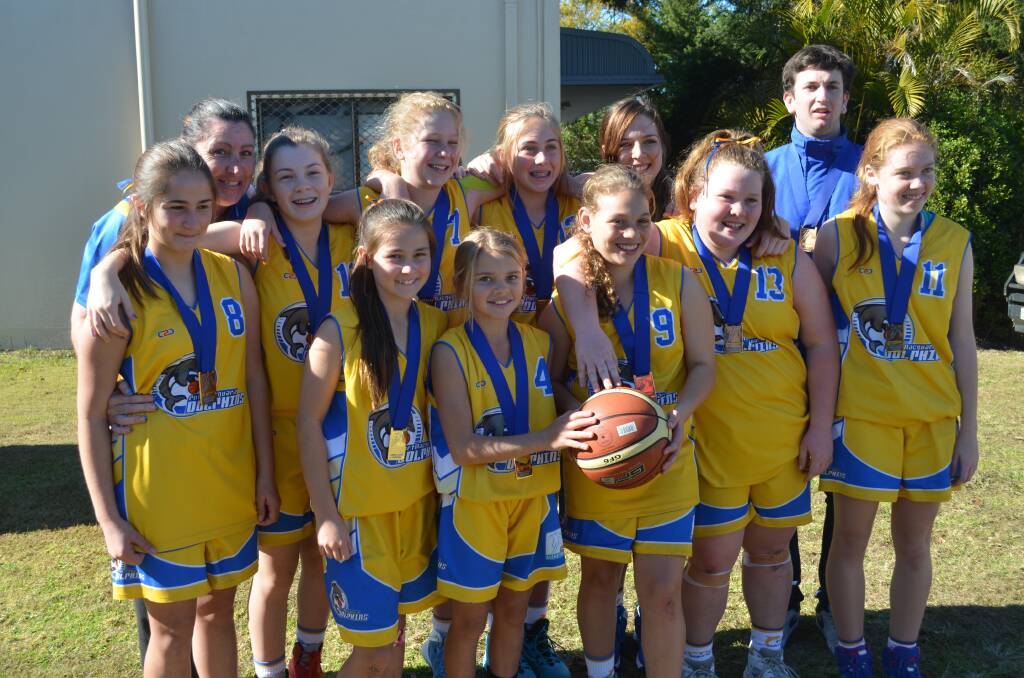 That winning feeling: Port Macquarie's victorious girls under 14 basketball team.