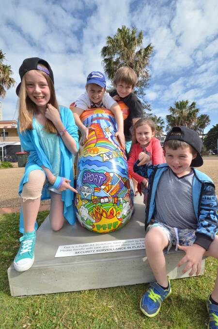 Which is my best angle?: The News' cheeky koala Scoop is bound to be a favourite with the kids. He's pictured here with Nikita Roberts, Brook McArdle, Jordan Hinton, Alicia Roberts and Daniel Roberts.
