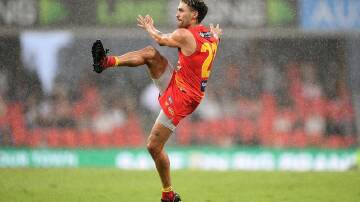 Gold Coast star Izak Rankine is weighing his AFL future following an offer from Adelaide. (Dave Hunt/AAP PHOTOS)