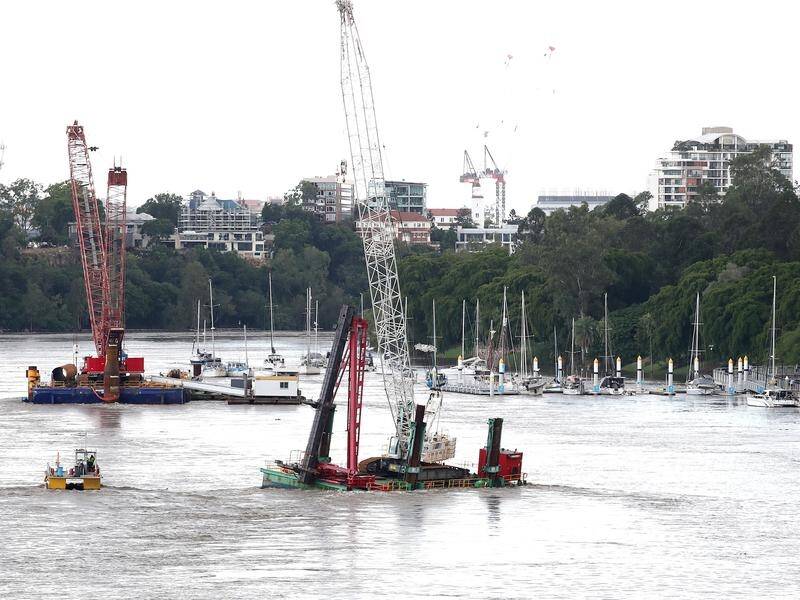 There are fears a loose floating crane in Brisbane could smash into wharves or damage bridges.