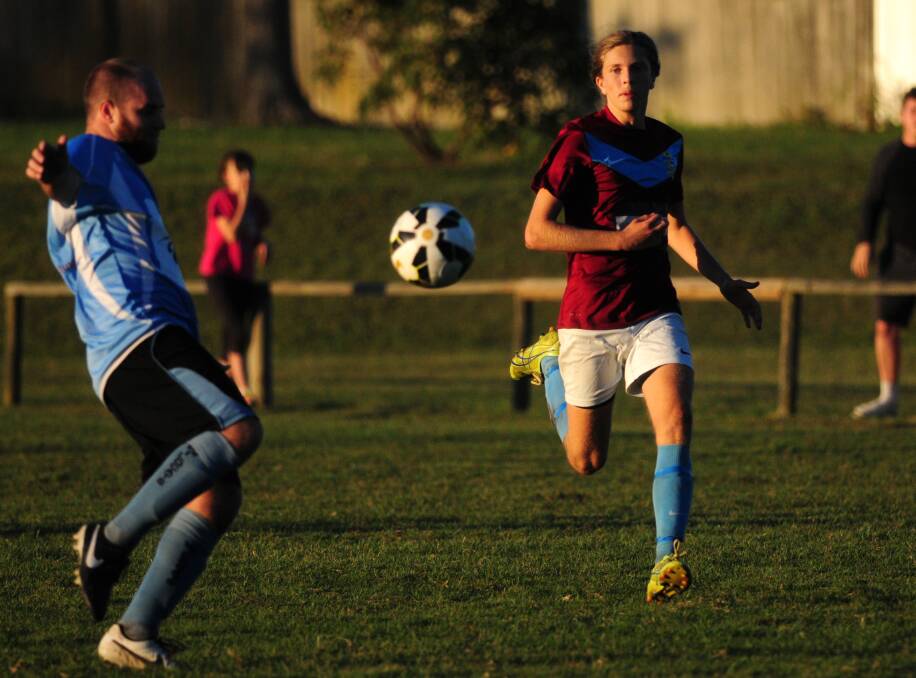 Hunting the cats: Sam Langley chases the ball for Port FC against Taree Wildcats. FC hosts Port Saints tomorrow in what shapes up as a tough week for the opposition.