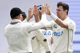 New Zealand's Matt Henry (right) celebrates taking the wicket of Steve Smith for 31 in Wellington. (AP PHOTO)
