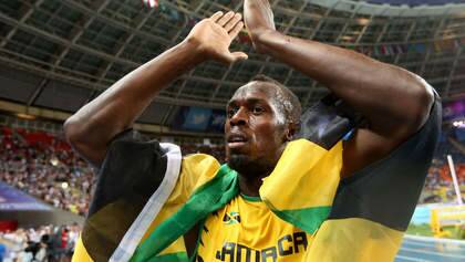 Jamaica's Usain Bolt celebrates after winning the100 metres final at the 2013 IAAF World Championships at the Luzhniki stadium in Moscow on August 11, 2013. Bolt timed a season's best 9.77 seconds, with American Justin Gatlin claiming silver in 9.85sec and Nesta Carter, also of Jamaica, taking bronze in 9.95sec. 
   AFP PHOTO / FRANCK FIFE Photo: FRANCK FIFE