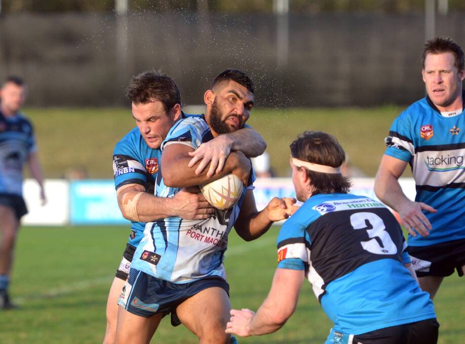 On the charge: Richie Roberts hits it up for the Breakers last weekend against the Sharks. The Breakers take on Wingham Tigers at Regional Stadium tomorrow.