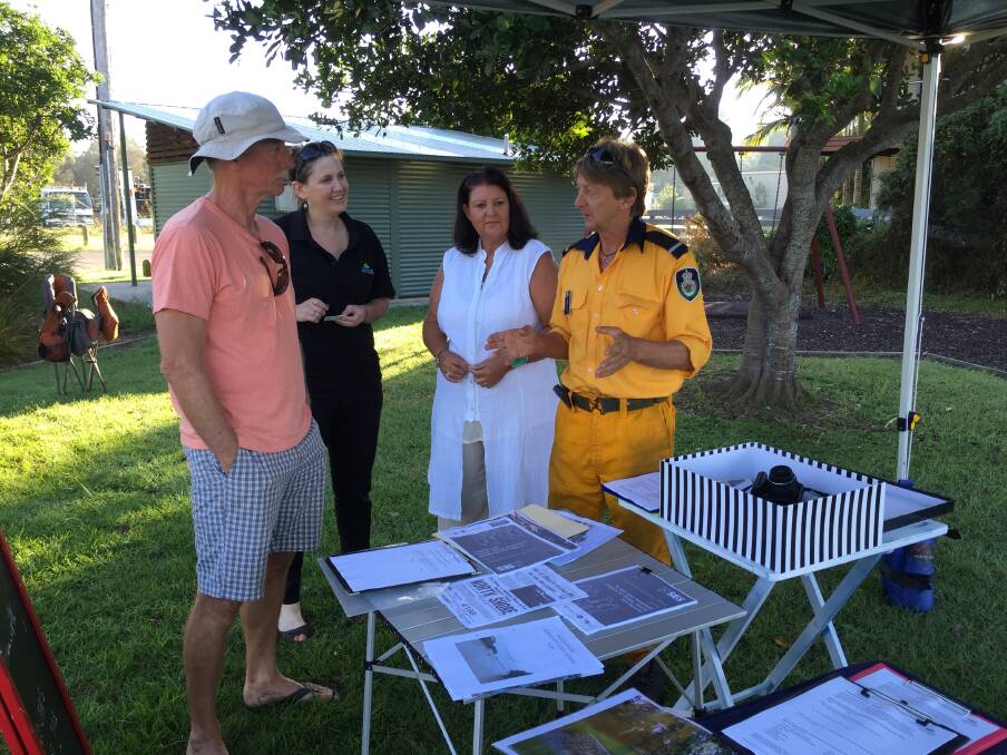 Community news: North Shore resident Alan Carson, Port Macquarie-Hastings Council's Skye Frost and North Side Progress Association member Carla McKern and president Kingsley Searle discussing the new flood evacuation program and plans for the coal wharf.