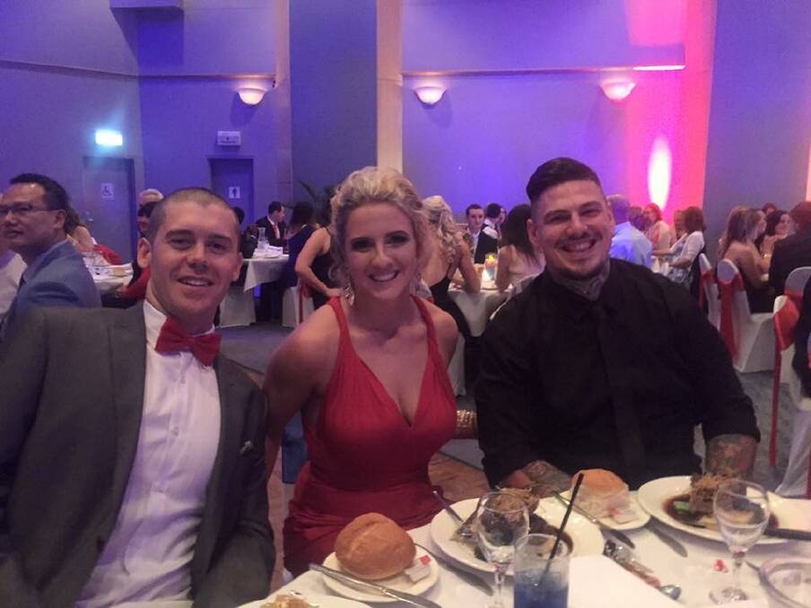 Well done: Finally able to enjoy the evening are organisers Dane Rickwood, Jessica Genders and Daniel Steinbeck at the Red and Blue Emergency Services Ball to raise funds for community defibrillators.