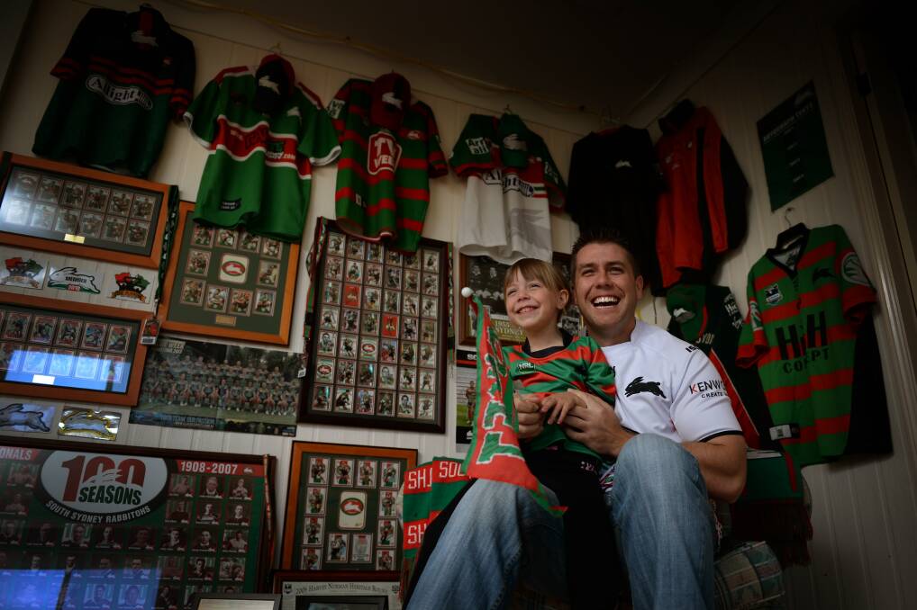 ALL SMILES: South Sydney Rabbitohs fans Megan Clarke, who's nearly five, and dad Tim, 33. Picture: Marina Neil