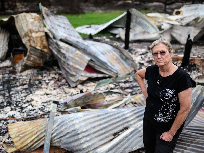 Averill Berryman lost her real estate office and her dog grooming salon when fire tore through Mogo.