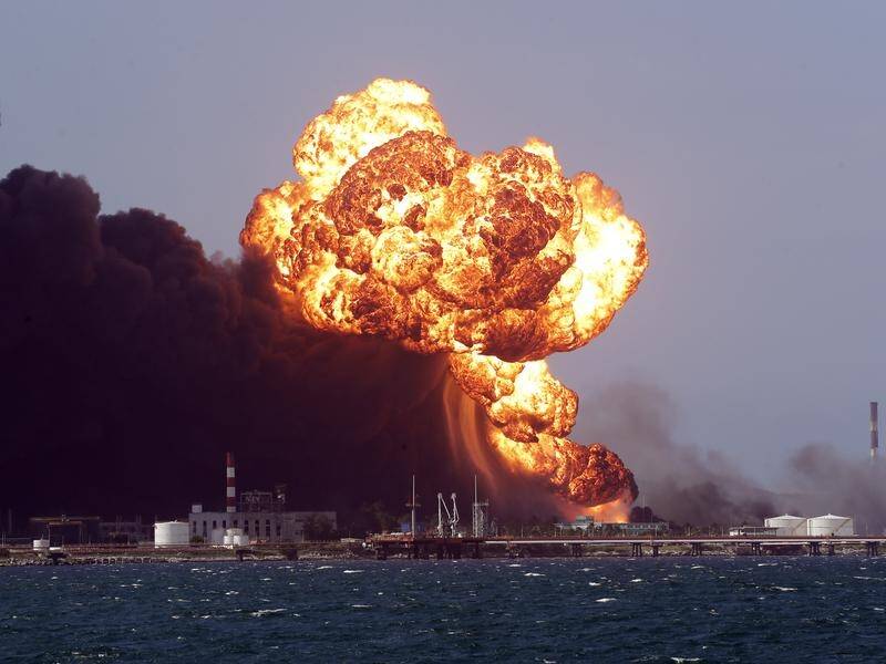 Flames spread like an "Olympic torch" from one tank to the next, the Matanzas governor said. (EPA PHOTO)