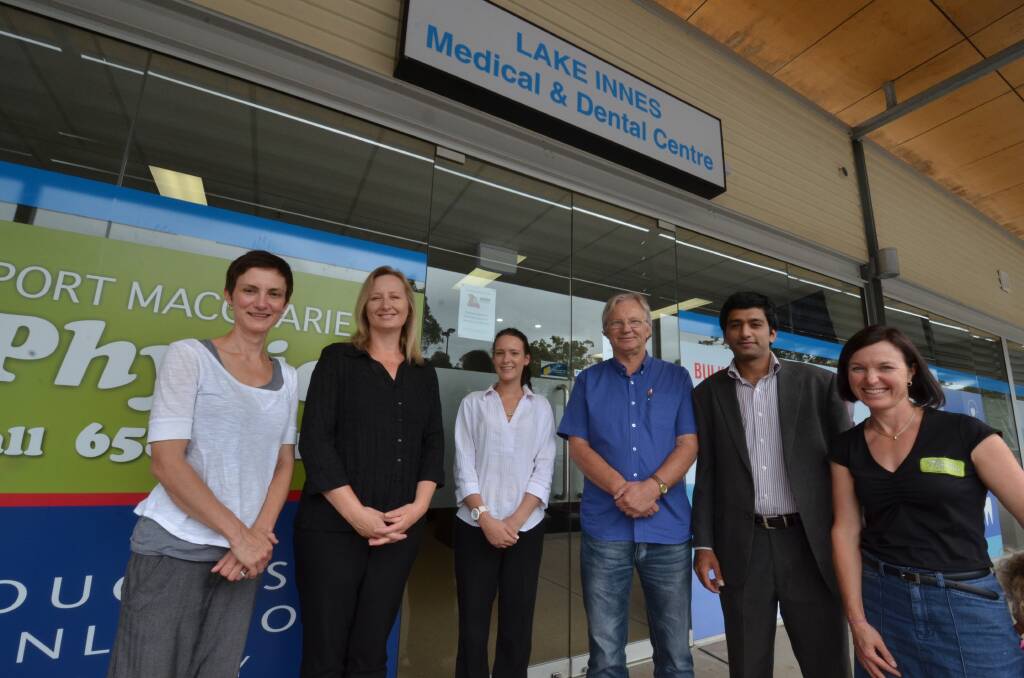 Strong team: Sara Spencer and Janene Gregson from Port Macquarie Physio and Pilates, dental assistant Rhi Neal, GP Dr Gerry Vanderslink, practice manager Dr Hassan Mahmood and Catherine McLean from Port Macquarie Physio and Pilates outside Lake Innes Village Medical and Dental Clinic.