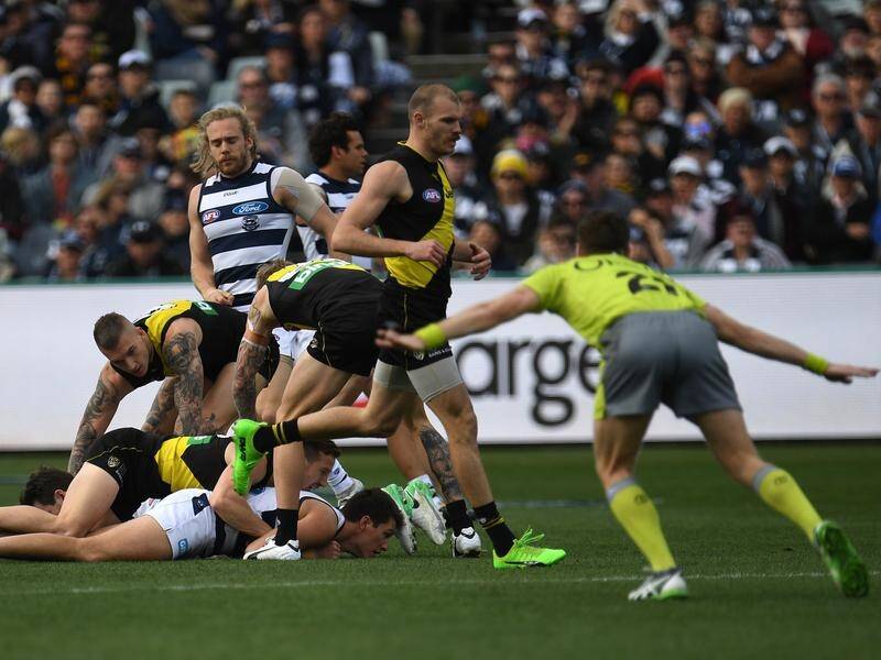 The holding-the-ball rule has again become a hot topic in the AFL.