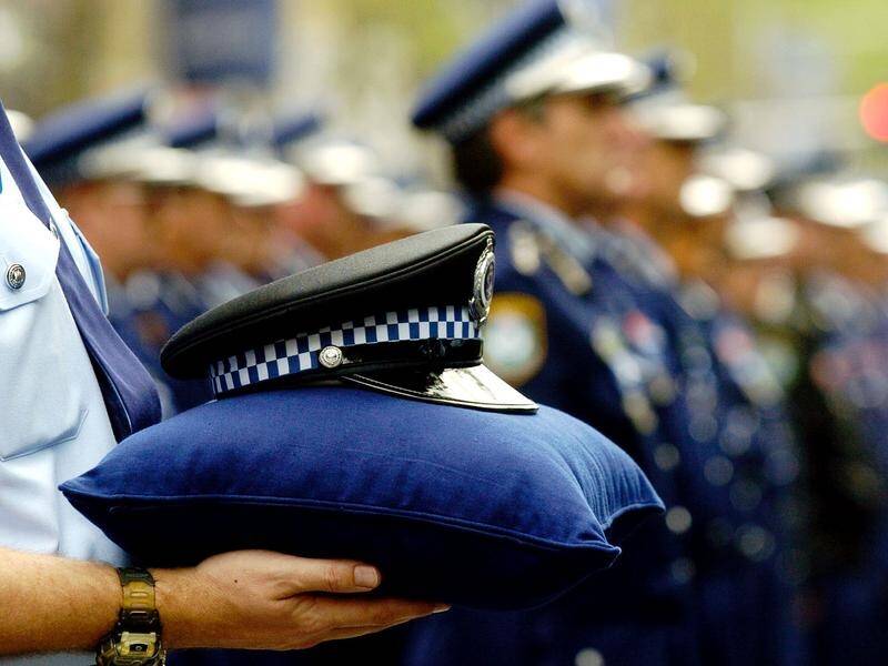 Services are being held across Australia to honour fallen officers on Police Remembrance Day. (Paul Miller/AAP PHOTOS)