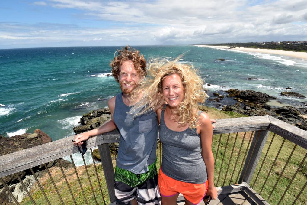 Breezy: British couple Chris Miller and Stacey Purath found it windy at Lighthouse Beach yesterday. It's likely to remain that way until at least until tomorrow afternoon. Pic: NIGEL McNEIL