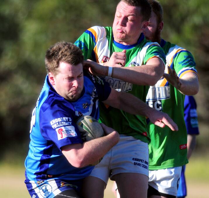 Nathan Kerr on the charge for the Kendall Blues in their clash against Lake Cathie Raiders. Ben Alaban is the Raiders' defender.
