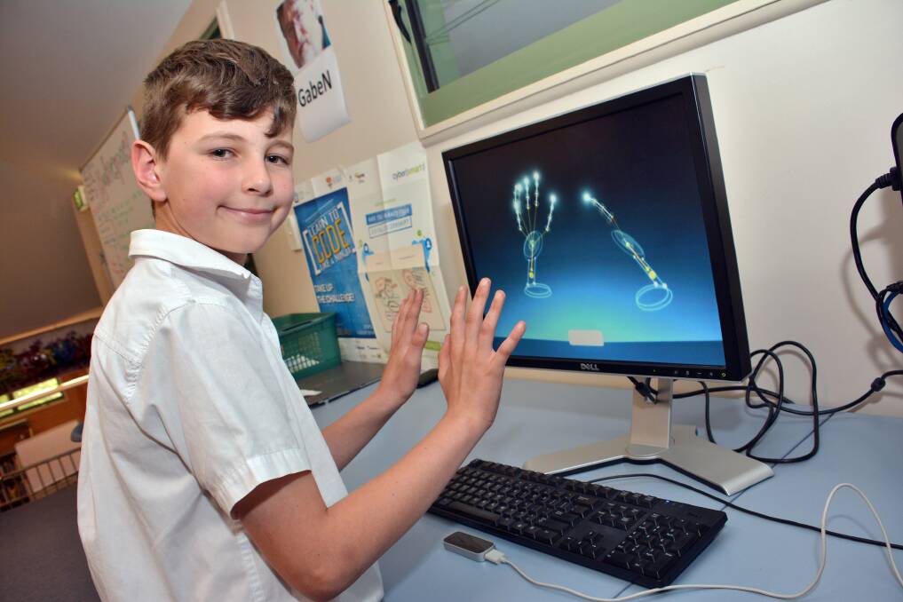 Gadgetry: Max Cutler plays with the new motion sensor ‘Makerspace’ computer at St Columba Anglican School in his free time.