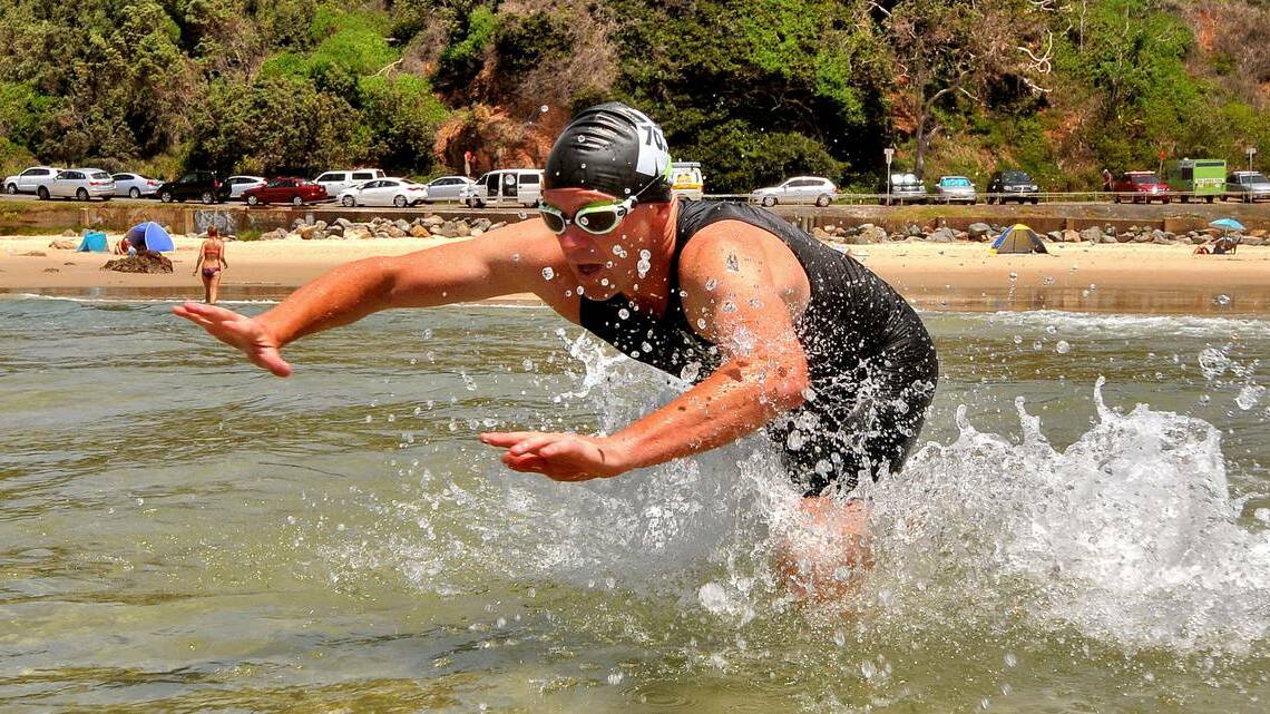 Nathan Pensini dives in at Flynns Beach. Pensini is the race director of the upcoming Port Macquarie Ocean Swim. Pic: Port Macquarie News