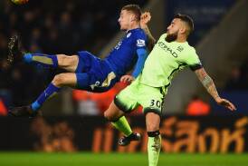 City v City: Leicester City's Jamie Vardy has been at the heart of the 2015-16 fairytale. He's battling for possession with Manchester City's Nicolas Otamend in the clash on Wednesday morning. Pic: GETTY IMAGES