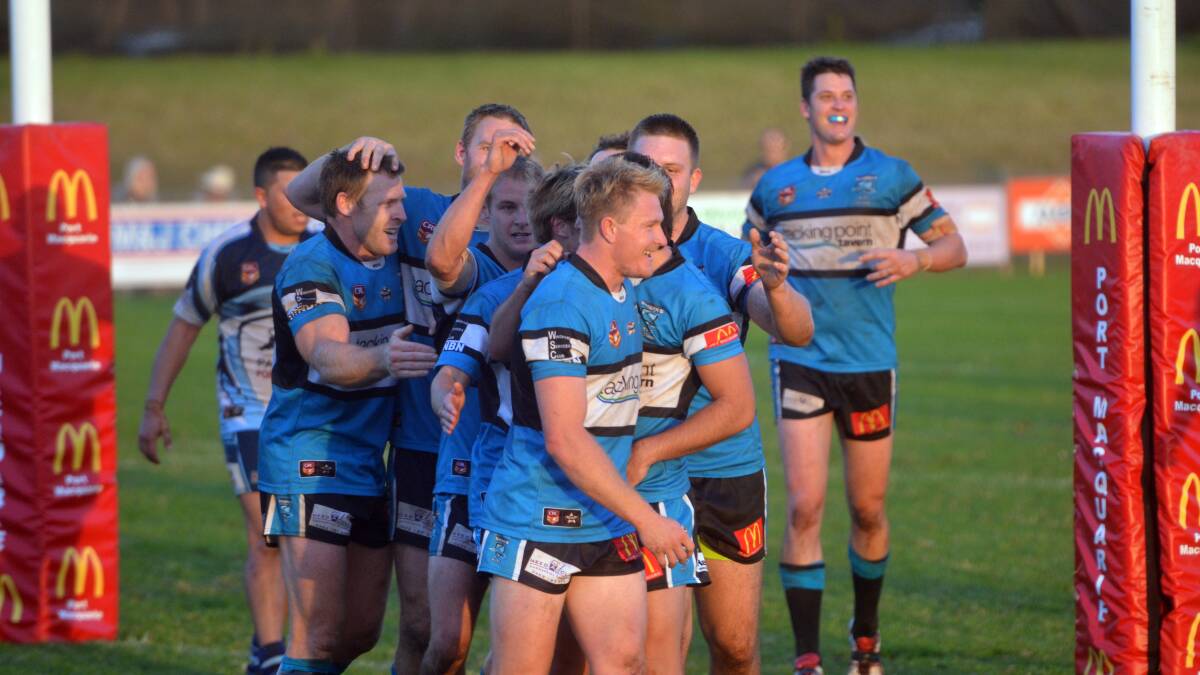 High fives: Port Sharks congratulate Harley Gore on a try in the derby win over Port City Breakers. Pic: PETER GLEESON