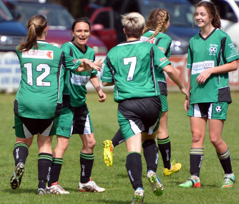 Celebrations: The Port United women's team celebrate a goal during their grand final win on the weekend.
