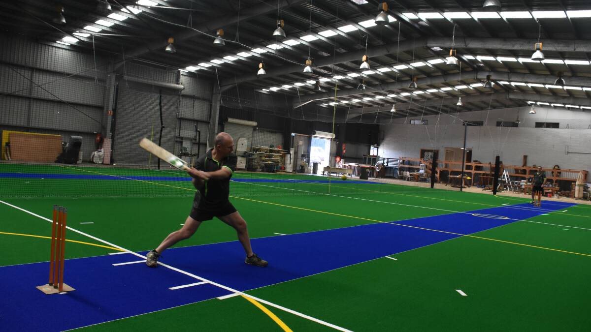 Having a hit: Ark Sports Centre CEO Gerrett Wilken tests out the new pitch with manager Todd Ruttley. Pic: NIGEL McNEIL