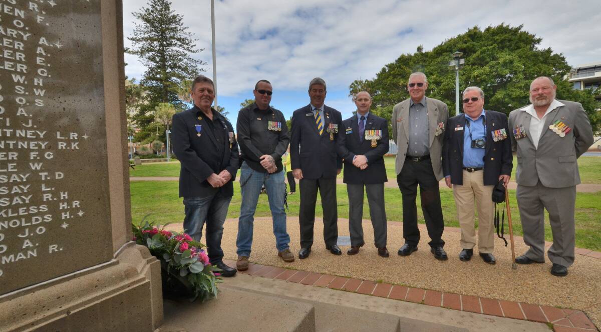 Tribute: Veterans Ray Knapp, Clint Brennen, Greg Laird, Jason Gill, Mal Butler, Bruce  Cater, and Greg Davis at Port Macquarie's first wreath laying in honour of those who lost their lives in the 9/11 terrorist attacks in America.