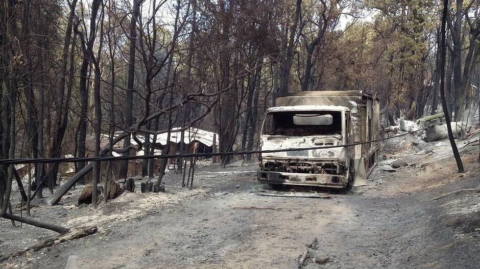 A bushfire burning out of control in the Perth hills has claimed one life and 44 homes. Pictures: DFES and Channel 10