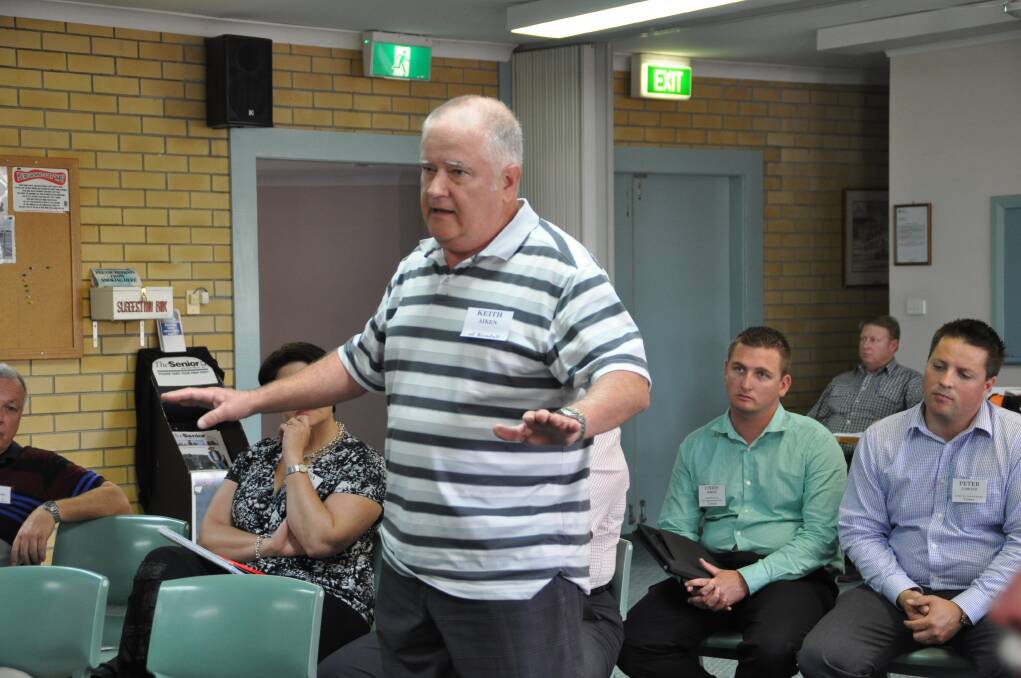 Poor coverage: Kendall resident, Keith Aiken addresses Paul Fletcher during the forum. Mr Aiken lives approximately 1km from the Pacific Highway and is unable to receive mobile phone coverage in his home or on his property; he reported that his mobile phone coverage during a recent trip to Egypt was far superior to that available in a first world country like Australia.