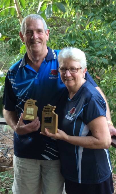 MASTERS: Alan and Jill Bowler with their trophies earned at the 2016 Australian Masters Squash Championships held in Darwin.