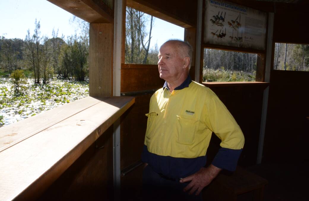 Bob looks out of the bird hide to the lagoon. The hide was constructed in 2017.
