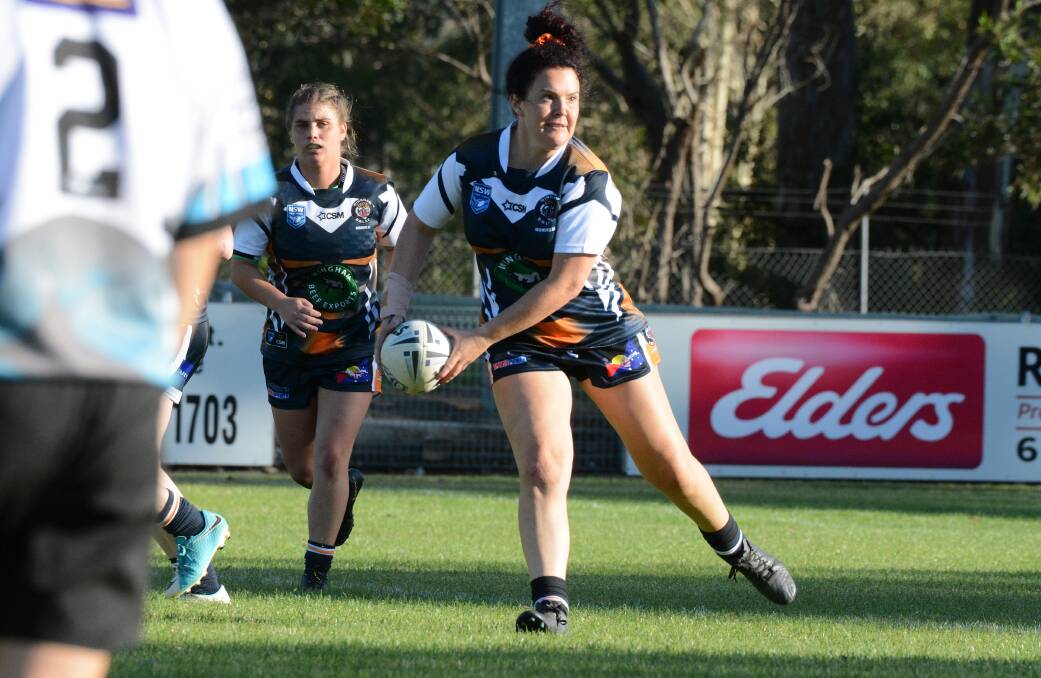 Sarah Grofos shapes a pass for Wingham against Port Macquarie Sharks. 