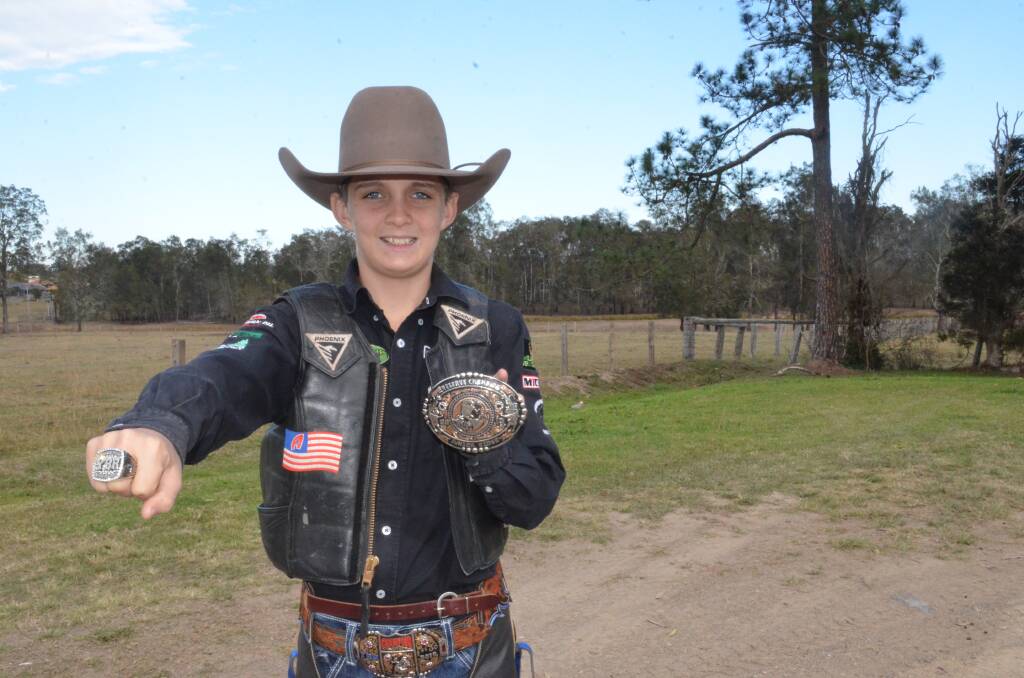 Levi Ward proudly shows off his new ring and buckle after a second place finish at the Youth Bull Riding World Finals. Photo: Callum McGregor