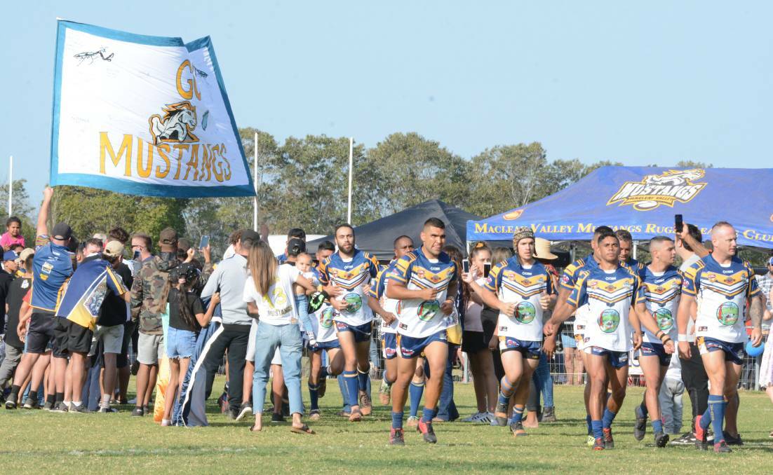 The Macleay Valley Mustangs run out onto the field on grand final day. Photo: Scott Calvin